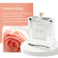 Honey Rose reed diffuser in a transparent glass bottle with luxury floral scent notes - Honey Rose