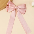Pink satin double-layered bow hair clip with long ribbons on a minimalist background - Pink