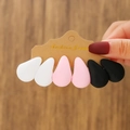 Detailed macro of matte white, pink and black C-shaped acrylic hoop earrings set - Black White Pink Matte (E0163-1)