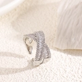 Macro detail showing the silver-plated X-shaped cross ring with baguette-cut cubic zirconia - Adjustable / Silver (Cross Design)