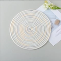 Handwoven round cotton placemat in white with blue and yellow zigzag spiral stitching - Cool Multi-color