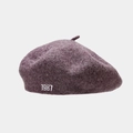 Close-up of white 1987 embroidery on a deep purple wool felt beret for women - One Size / Flower Purple