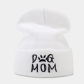 Close-up of white knit beanie with black DOG MOM embroidery and paw print detail - DOG MOM / White