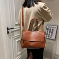 Brown crocodile pattern large tote bag worn by model in a stylish office setting - Brown