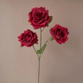 Artificial bouquet with three dark red roses and green leaves on a slim floral stem - Red