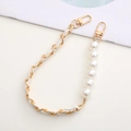 Detail of white leather woven golden metal chain with pearl beads for handbag accessory - Leather Clasp Hand Strap / White