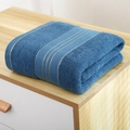 Thick navy blue cotton towel featuring elegant gold satin stripes on a light wooden surface - 140x70cm / Blue