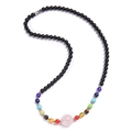 Black beaded necklace with chakra stones and pink crystal pendant on white background - Rose Quartz Necklace