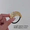 Minimalist gold hair tie featuring an irregular hammered texture metal plate ornament - Hammered 2-Layer Gold