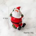 Miniature sitting Santa Claus resin ornament with green gift bag, 6.5cm height - Santa with Backpack and Gift Box