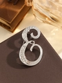 Elegant silver letter E brooch pin with white rhinestones on vintage leather background - Silver Letter E