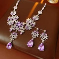 Detailed view of vintage jewelry set with purple drop zirconia and silver flower motifs - Purple Necklace and Earring Set (2-Piece)