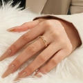 Macro detail of adjustable golden orbital ring with pavé crystals on a model hand - Gold Twist Rope Texture Style (ALR041GLW)