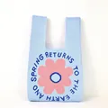 Close-up of light blue knitted tote bag with pink flower and spring letter pattern - Blue Pink Large Flower