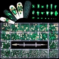 Macro shot of 21-grid emerald green nail art rhinestones with dual-ended picker dotting pen - Emerald Green Set / 21 Grids/600 Large+2500 Flatback