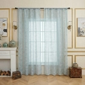 Light blue floral lace sheer curtain hanging on black rod in a bright modern living room - Blue Star Ray (Rod Pocket) / W140*H100