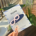 Detail of creative blue fabric bow hair clip with pink polka dot glasses on card - Starry Blue Glasses BB Hair Clip