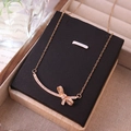 Élégant collier en acier titane doré avec pendentif nœud souriant en zircon pavé - Sourire à Nœud Papillon Or Rose