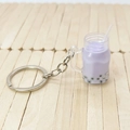 Portachiavi creativo bubble tea viola con perle e anello argento su supporto in legno - Taro