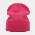 Macro detail of high-quality magenta ribbed knit beanie with soft textured fabric - Deep Pink