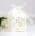 Detailed laser-cut heart pattern on white wedding favor box with a satin ribbon - Ivory