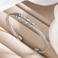Silver stainless steel cable wire cuff bracelet with polished spiral ring accents - Steel