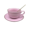 Detail view of a matte pink ceramic coffee cup with gold rim and matching spoon - Pumpkin Shape-Purple