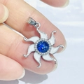 Silver sunflower pendant with a blue gemstone center and white enamel petals - Silver Enamel Sunflower