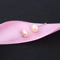 Macro shot of S925 sterling silver studs with round light pink freshwater pearls - 8-8.5mm / Pink