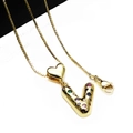 Detail of gold letter V and heart pendant necklace with colorful zircon stones - Pendant with Necklace / Letter V