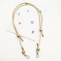 Close-up of champagne gold adjustable rope shoulder strap with metal lobster clasps - Gold Plate Hook / Gold