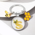Detail of bee keychain with letter S glass dome charm and pearl bee pendant - Letter S