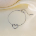 Sleek silver stainless steel snake chain bracelet featuring a hollow heart pendant - E2216 Heart Bracelet Silver