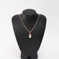 Detail of Christmas snowman pendant with red hat and scarf on gold chain necklace - Snowman