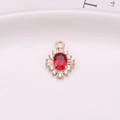 Luxe gold-plated sunflower pendant with a ruby-red oval gem and white zircons - Red