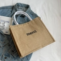 Large linen tote bag with 'merci' print and white woven handles in natural jute color - Merci Small Letter Style