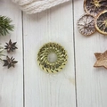 Golden expandable bird nest hair ring for ponytail styling on a decorative wood surface - Electroplated Gold