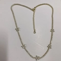 Golden tennis choker necklace featuring five flower charms with white zircon accents - White