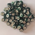 Macro shot of 7x12mm green rhinestone large hole beads with silver metal inner cores - Dark Green