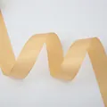 Detail of champagne gold satin ribbon with glossy texture and smooth wavy curves - Wide Champagne Gold Ribbon (4cm Width 5m Length)