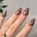 Glossy mocha brown almond press-on nails with a high-shine finish on natural hands - Dark Brown (JP2999)