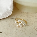 Golden vintage pearl butterfly ring with white clustered pearls on beige background - Pearl Flower Cluster Open Ring