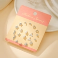 Set of 9 pairs of silver titanium steel earrings with stars, pearls and crystal studs - Silver Fish Tail Star (E1917-1)