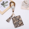Detail of snake skin pattern card holder with wooden beads and tassel keychain - Brown Snakeskin