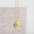 Detail of a gold oval locket necklace with sunburst engraving and side hinge for photos - Sun Pattern (11977_2) / Gold