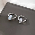Vintage stainless steel hoop earrings with blue natural stone beads from a 45-degree angle - Translucent White Natural Stone