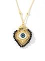 Dettaglio del ciondolo a cuore in oro 18k con malocchio blu e catena di perle nere - Nero