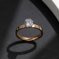 Elegant rose gold titanium ring featuring a central round zircon and diamond-studded band - US 6 / Rose Gold