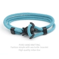 Detail of hand-woven sky blue Milan line bracelet with black matte sea turtle clasp - Sky Blue