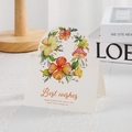Carte de vœux florale avec texte Best Wishes sur surface blanche et socle en bois - Ipomée